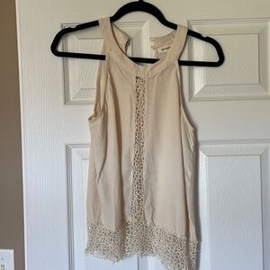 Cream colored top. Size medium
